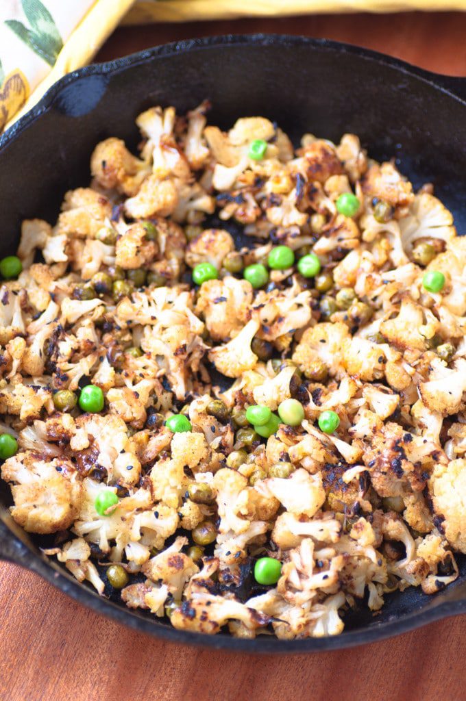 Stirfried Cauliflower With Peas is an easy and delicious side with distinct flavours of nigella seeds & curry. It’s ready in 25 mins and is perfect as a side or as a filling for wraps/ sandwiches. It’s #vegan, #glutenfree and #paleo friendly to boot. Only 171Cals/ portion. #realfood #vegetarian