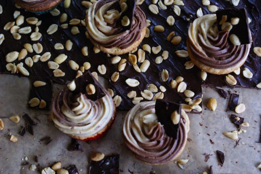 Two tone cupcakes with chocolate and peanuts