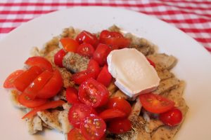 Fresh Homemade Egg Pasta With Tomatoes And Goat's Cheese