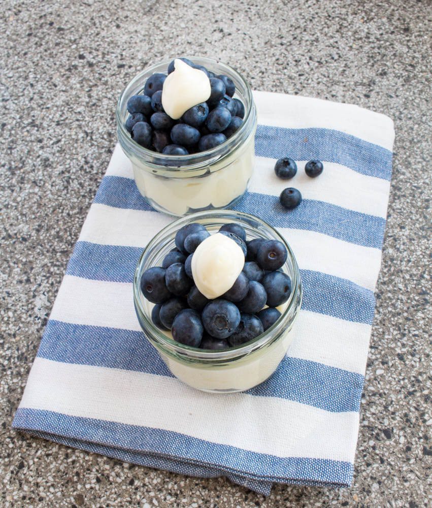 2 pots of chantilly cream and blueberries
