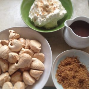 Mini Meringues With Smooth Chocolate Sauce And Ground Almond Praline