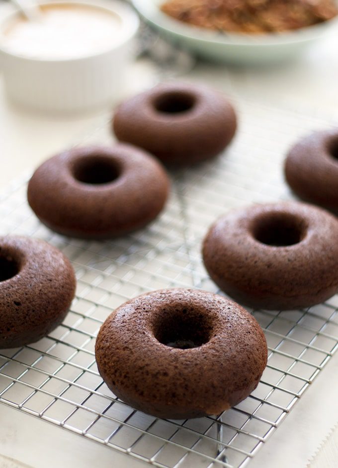 These turtle donuts start with a chocolate decadent donut, topped with caramel glaze and sprinkled with chopped pecans. | ahappyfooddance.com