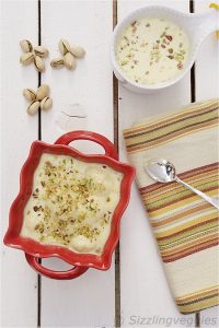 Rasmalai [Flattened Cheese Dumplings In Flavored Milk]