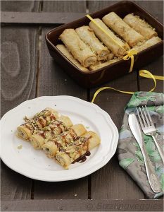 Chocolate Baklava Cigars Topped With Chocolate-Caramel Sauce