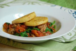 Sundried Tomato Polenta With Sausage, Spinach, And Fire-Roasted Tomatoes