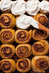 Pumpkin Cinnamon Rolls With Vanilla Bean Rum Frosting