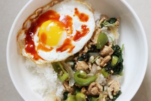 Rice Bowl With Chicken And Basil Topped With Fried Egg