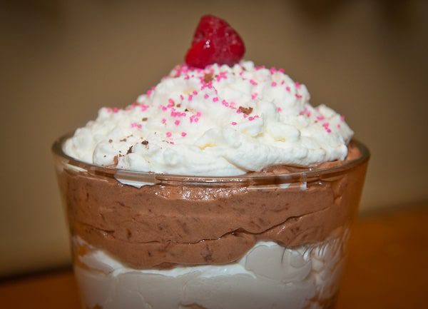 chocolate silk mousse topped with homemade whipped cream and a raspberry